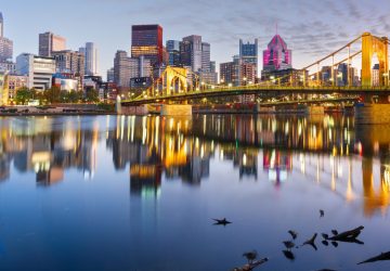 Pittsburgh, Pennsylvania, USA downtown city skyline on the Ohio River at dusk.